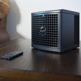 The compact pureAir 1500 resting on a living-room table with the remote.