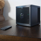 The compact pureAir 1500 resting on a living-room table with the remote. 